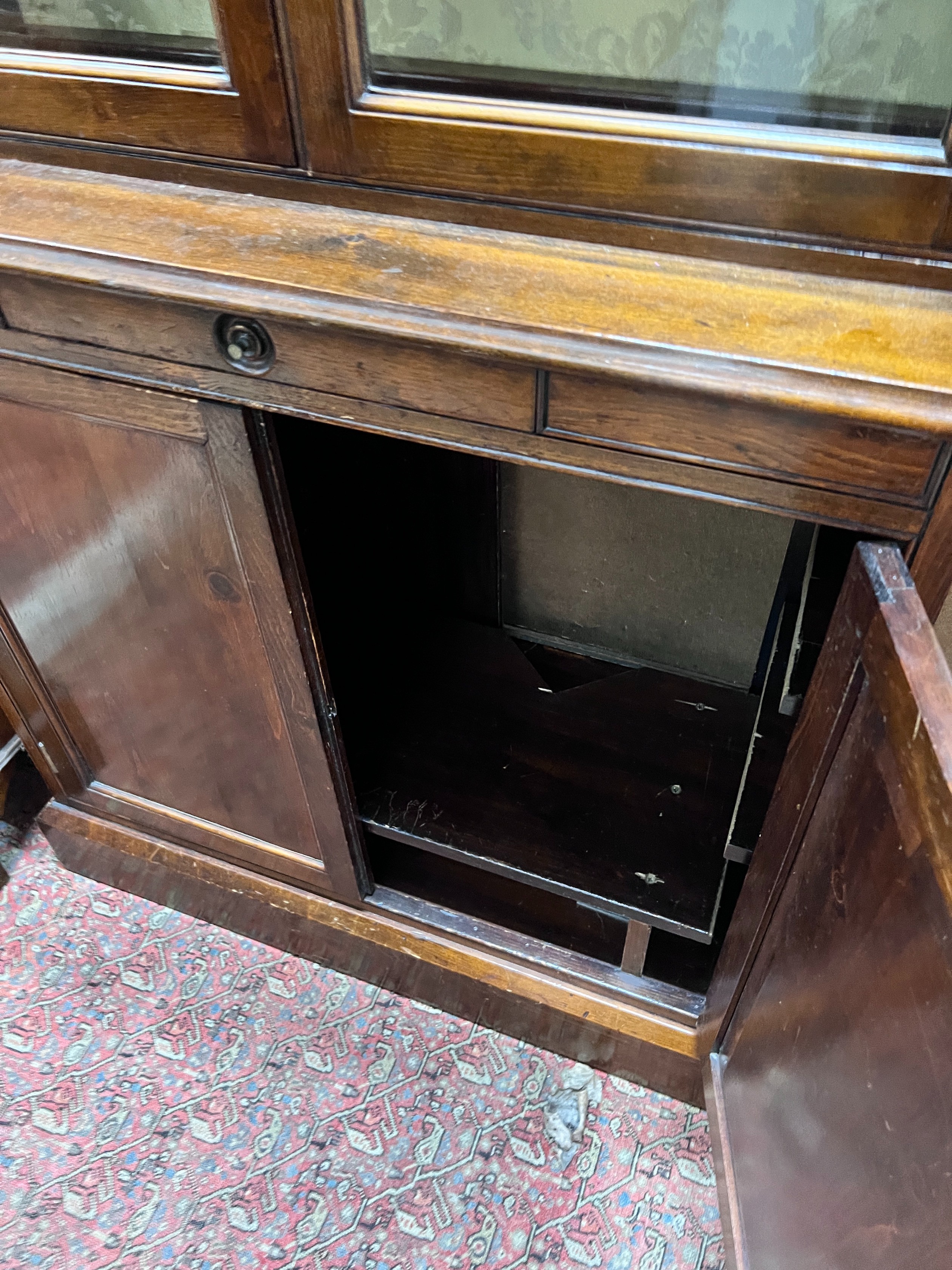 A Victorian pine bookcase cupboard, width 86cm, depth 35cm, height 190cm *Please note the sale commences at 9am.
